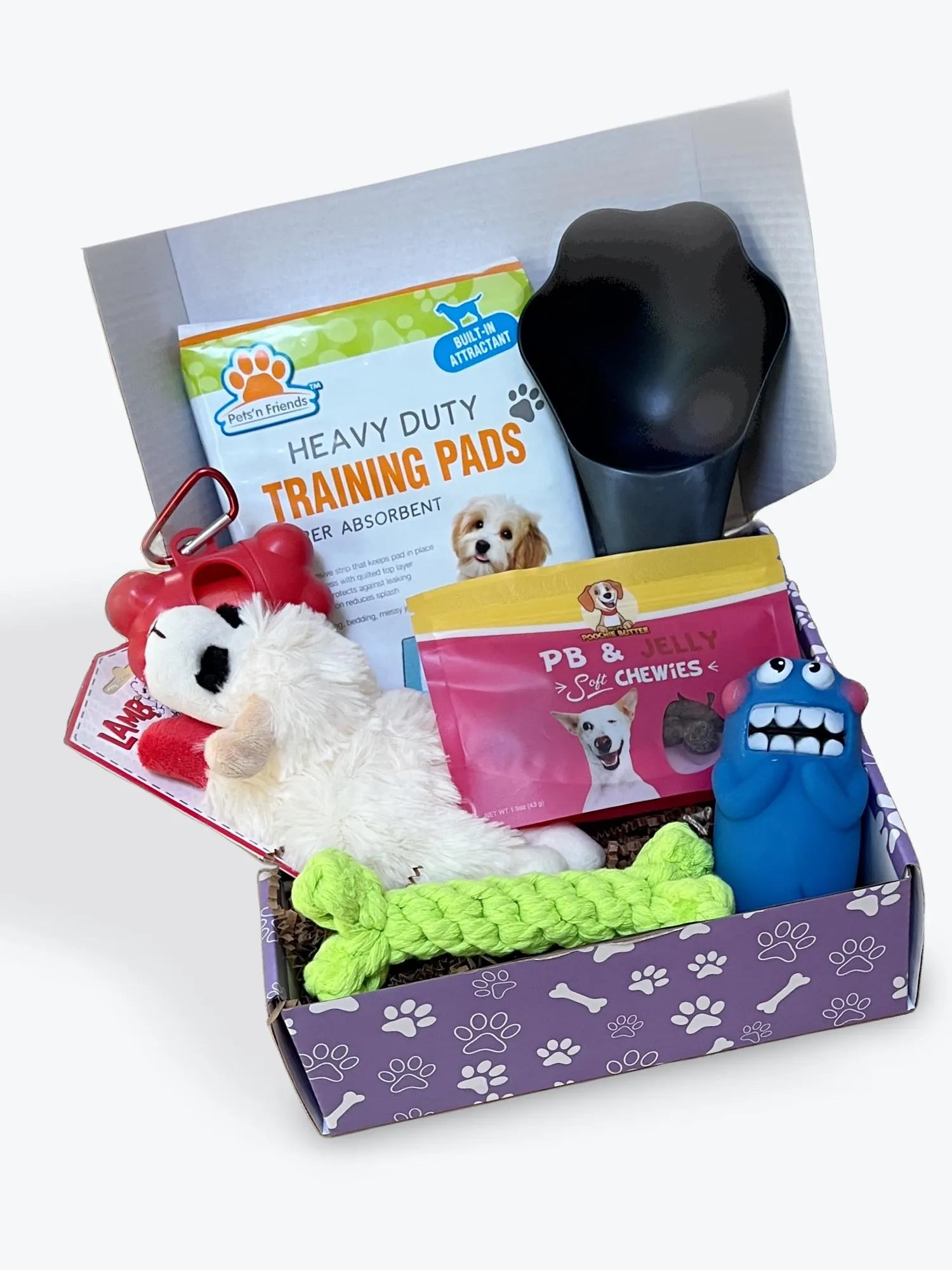 Puppy supplies box with toys and pads